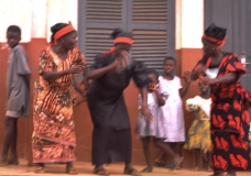 Woman dancing at funeral
