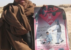 Afghan Boy and Landmine Poster