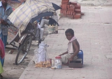 7yrs boy opareting street shop