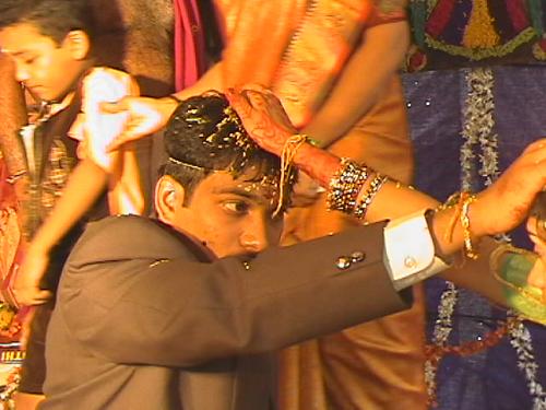 Suit can be replace traditional Indian costumes at wedding, but not the usage of Rice at Wedding