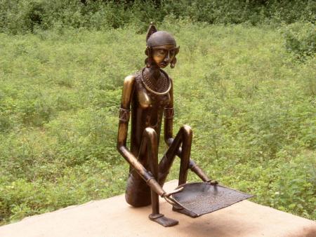 tribale lady cleaning rice