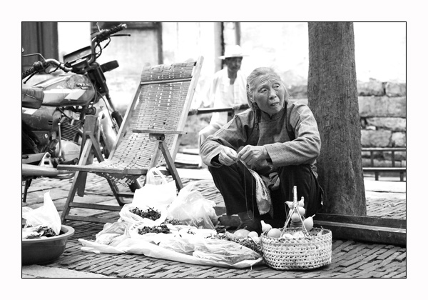 Selling herbs in Zhouzhuang
