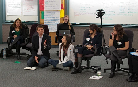 A group meeting and sharing ideas in a circle
