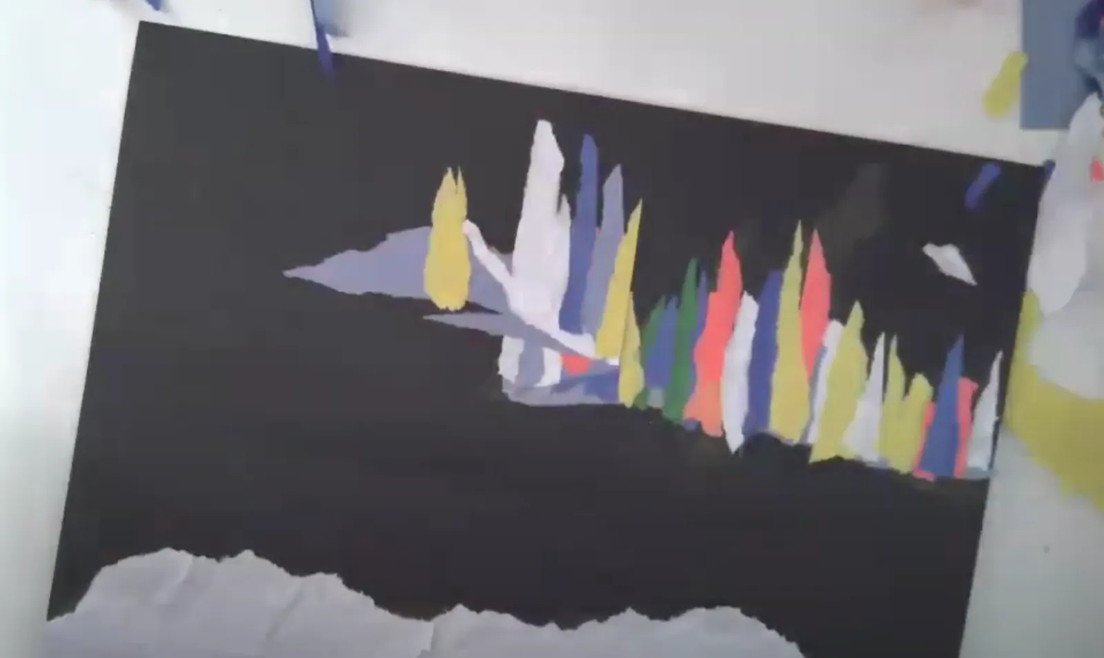 Jason Sikoak creating a mixed media collage of the Northern Lights
