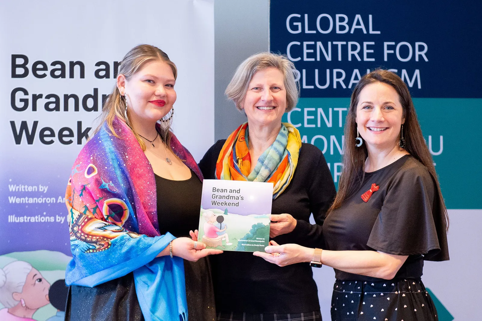 Author Wentanoron Ariana Roundpoint, Parliamentary Librarian Dr. Heather Lank, and TakingITGlobal Co-founder & Executive Director Jennifer Corriero