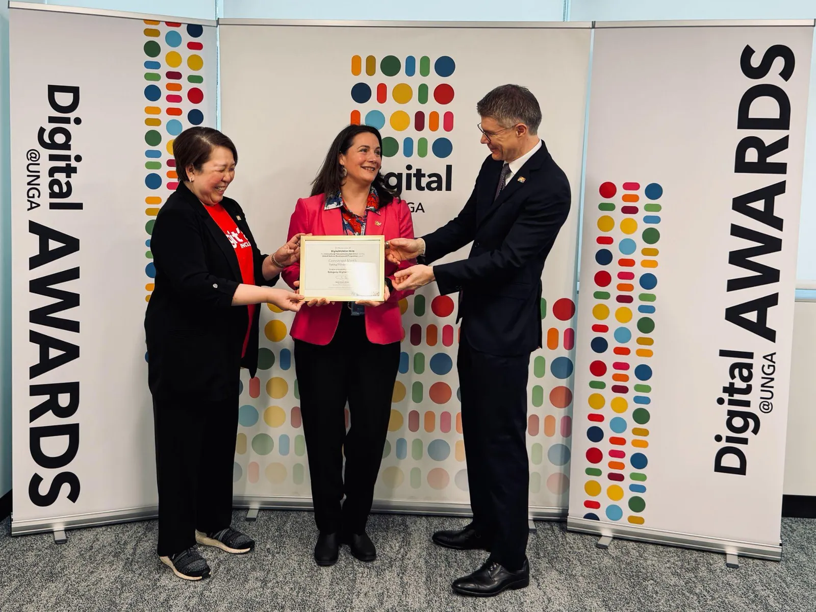 A framed Digital @ UNGA 2026 finalist certificate for Connected North being presented in front of Digital @ UNGA Awards banners.