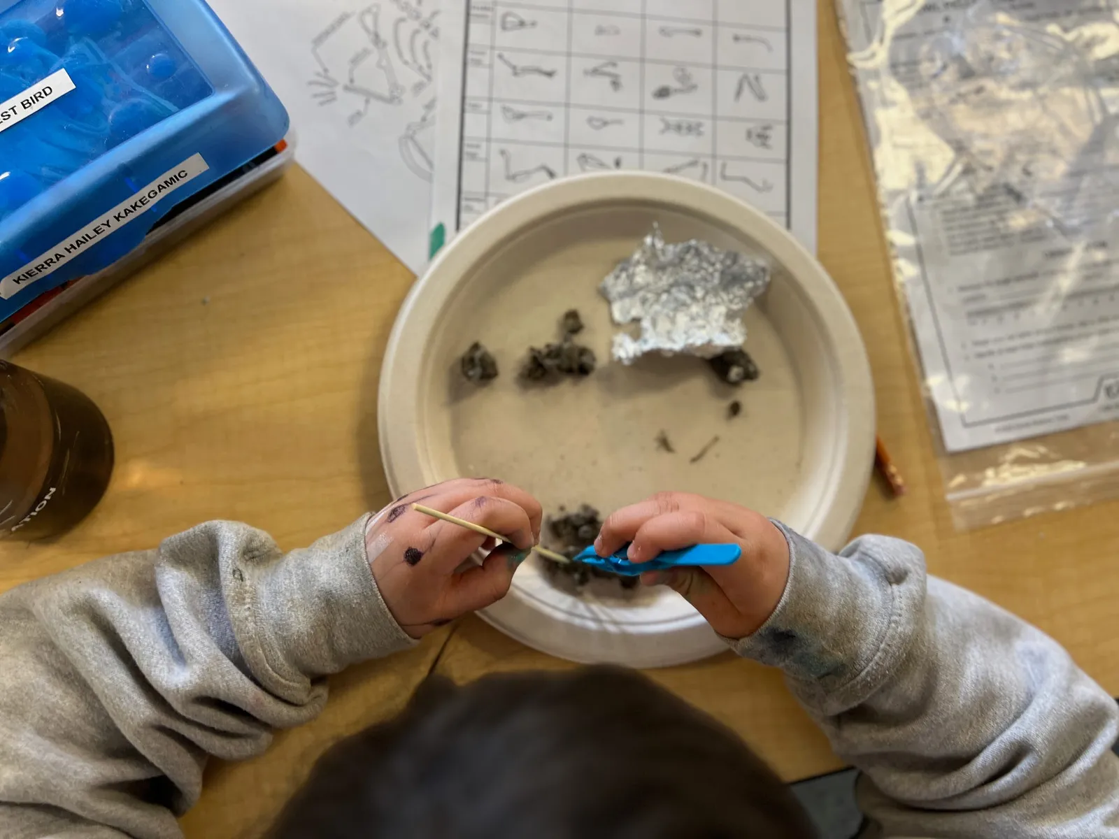 Student from Slate Falls First Nation participating in Owl Pellet dissection during Connected North session