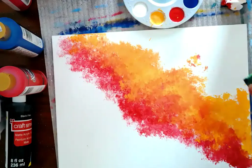 Heather showcasing how to use sponge to do the background of the galaxy